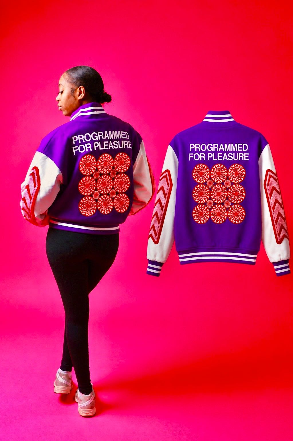 Girl wearing a purple jacket with 'Programmed for Pleasure' text and red floral patterns on a pink background