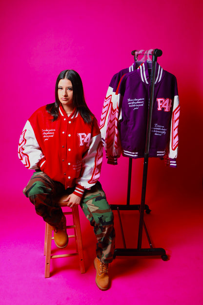 Pretty girl wearing a red and white 'P4P' varsity jacket with a pink background